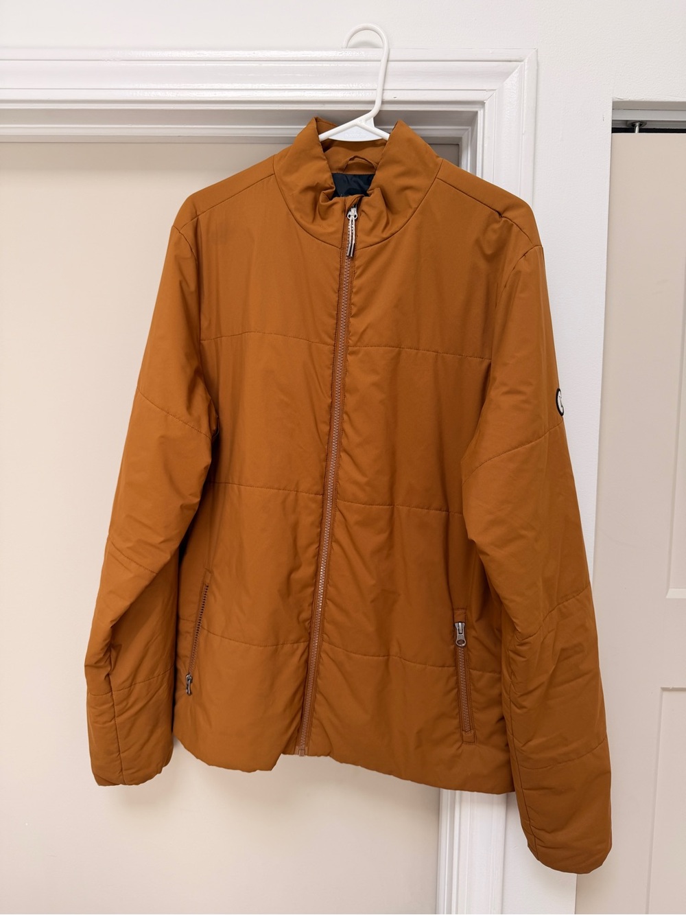 Vuori Men's Quilted Puffer Jacket in Rust Orange